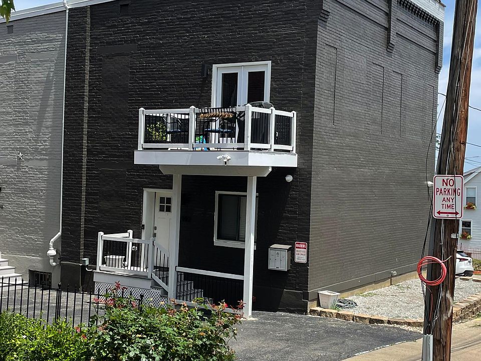 The end unit has a dedicated off-street parking spot outside the front door.