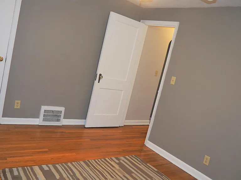 Door on left goes to the larger of the two master bedroom closets. Door on right accesses the hallway and bathroom.