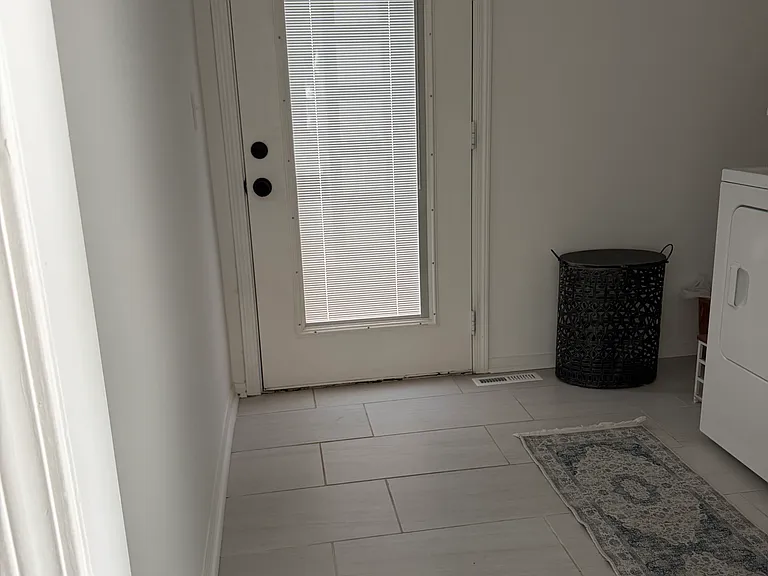 Main Level Laundry and exit to Large Back Patio