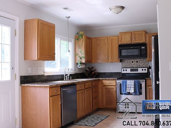 Kitchen w/ Granite and Stainless Appliances