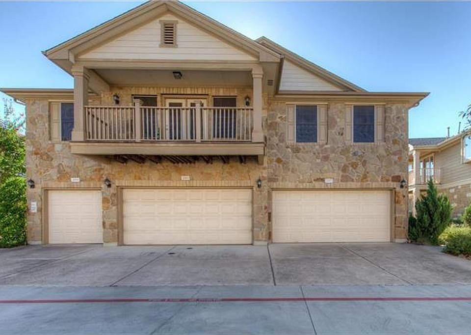 Front - 2002 is rightmost condo - 2 car garage entrance