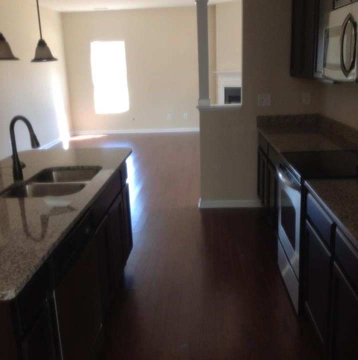 Open concept- Fully equipped kitchen with stainless steel appliances. Kitchen has eat- in breakfast nook with a large flat screen TV and then a back door leading to patio and huge backyard. Great home for entertaining guests with family room/living room,