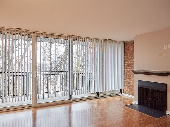 Living room, floor-to-ceiling doors, and porch.