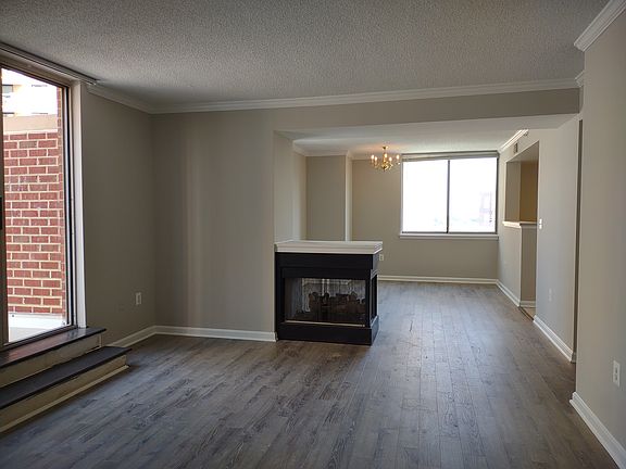 Pristine condo with a gas fireplace and a sliding door that leads to the biggest balcony in Lexington Square.