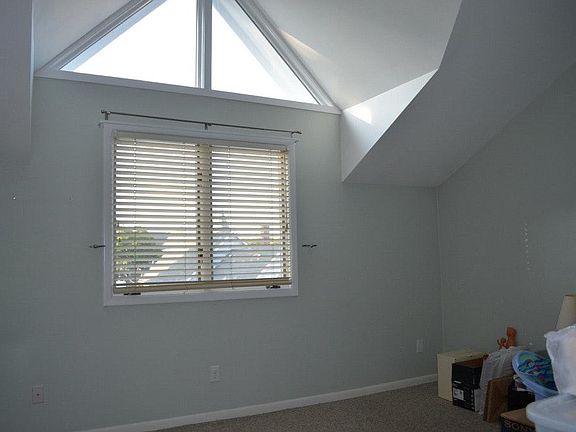 Master bedroom with vaulted ceilings and large closet