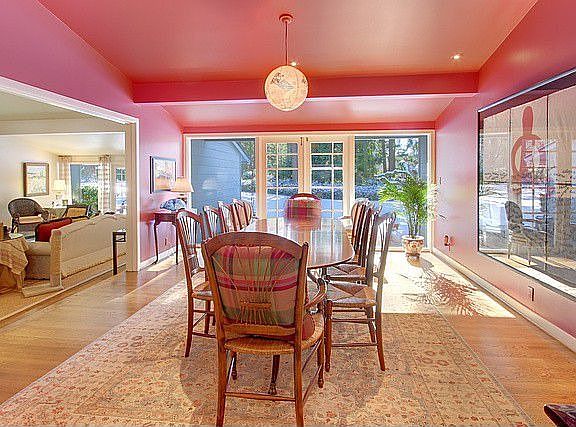 Beautiful French Doors allow the summer breeze in for a little dining al fresco!