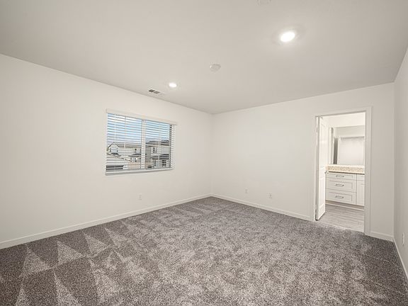 The family room is spacious and a large window.