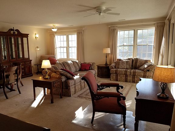 Living room with lots of windows.