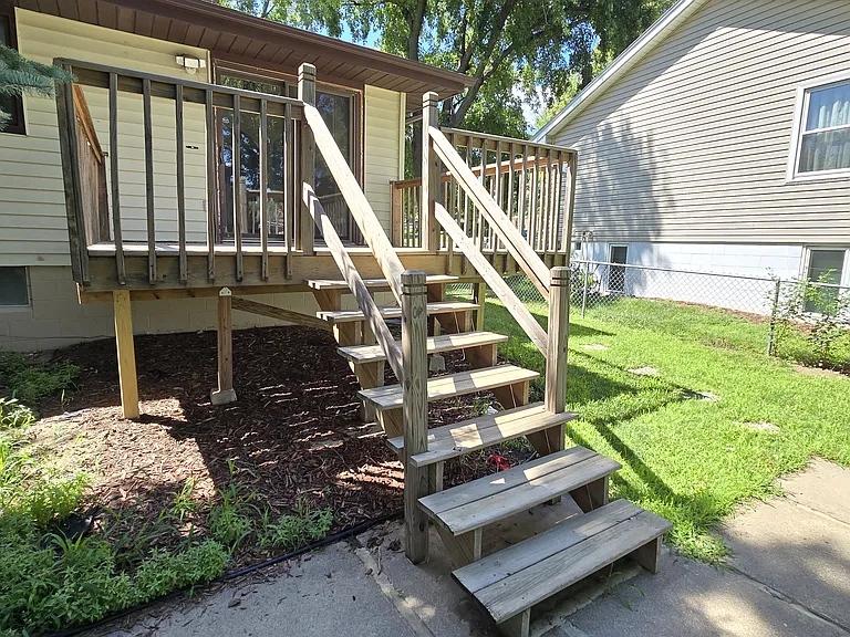 Deck stairs leading to back patio door