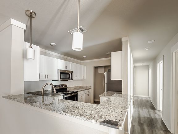 The Sanderling. A three bedroom, two bath apartment home located on the ground and second floor.