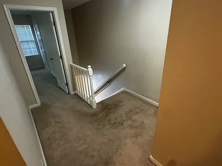 Spacious upstairs landing with storage that leads to the primary bedroom with en-suite bath, plus two additional bedrooms sharing a full bathroom.