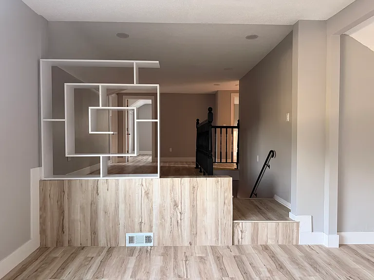 Large open loft area ideal for family room, or play area with modern built-in shelving and TV pre-wiring