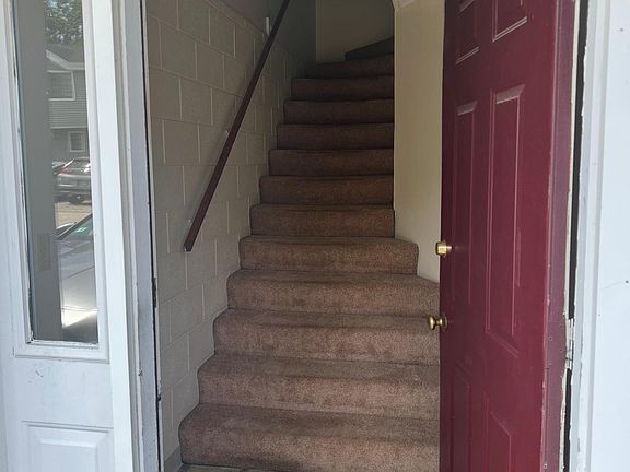 Stairs leading up to kitchen and living area