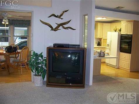 One more portion of great room with 2 way entry to kitchen and eating area in background. Very nice REAL hardwood floors in kitchen as well as hallway.