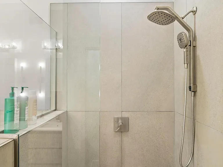 Walk in shower in primary bedroom ensuite bathroom