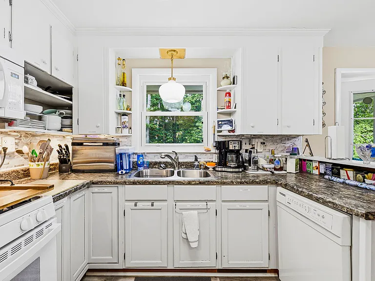 MAIN LEVEL: Kitchen with Stove, Sink, and Dishwasher (Dining Room with Double-opening French Doors leading to Back Porch on right)