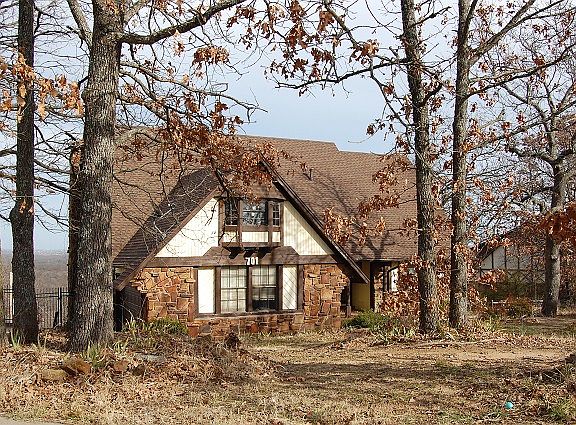 Room to roam in this home and mature trees.