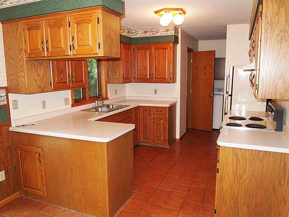 Ceramic tiled kitchen with window over sink