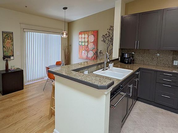Dining room with sliding glass doors and newly upgraded kitchen