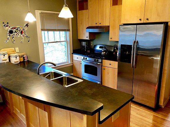Open kitchen with stainless steel appliances