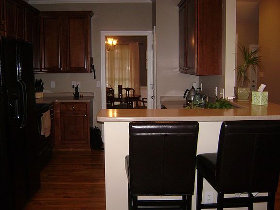 Kitchen w/ bar plus a breakfast area.