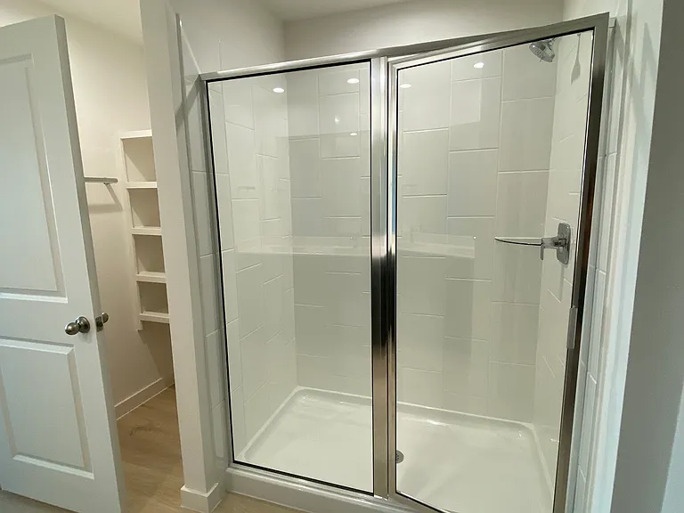 Master bathroom with large shower, additional storage space on the left
