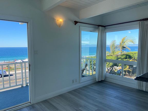 Dining area has ocean views and opens onto the enormous living room, private deck and gourmet kitchen with breakfast bar