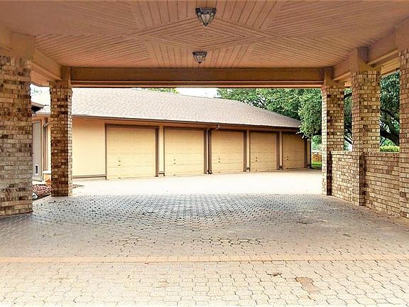 5 Car Garage with Half Bath and Workshop Area!