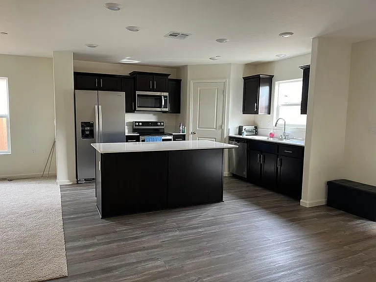 Kitchen view and partial living room view from the Dining area