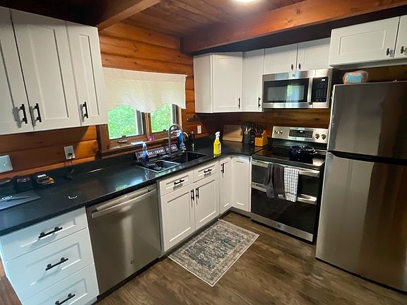 Kitchen renovated in 2025. Granite Counters. Shaker style Cabinets. Stainless appliances. Oven is air fryer. Sink has waterfall glasses cleaner, and reverse osmosis sytem for drinking water.