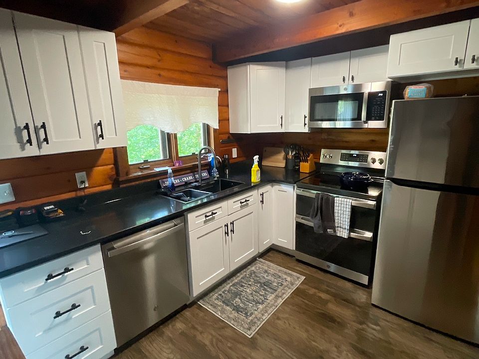 Kitchen renovated in 2025. Granite Counters. Shaker style Cabinets. Stainless appliances. Oven is air fryer. Sink has waterfall glasses cleaner, and reverse osmosis sytem for drinking water.