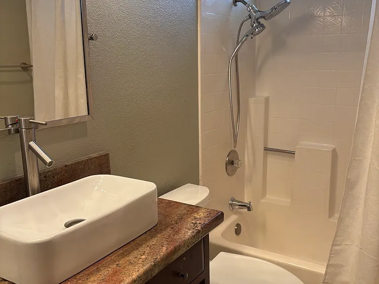 Shared bathroom with tub