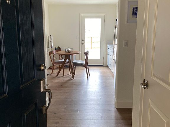 View from front door- Coat Closet to right, kitchen straight ahead and backdoor to backyard.