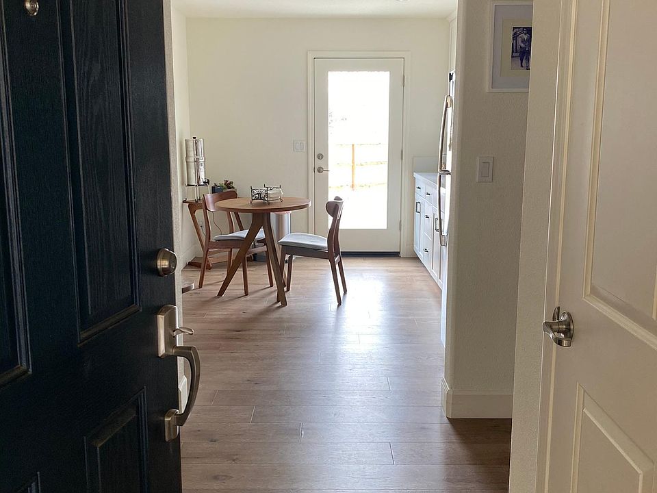 View from front door- Coat Closet to right, kitchen straight ahead and backdoor to backyard.