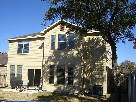 Large backyard with mature oak for shade
