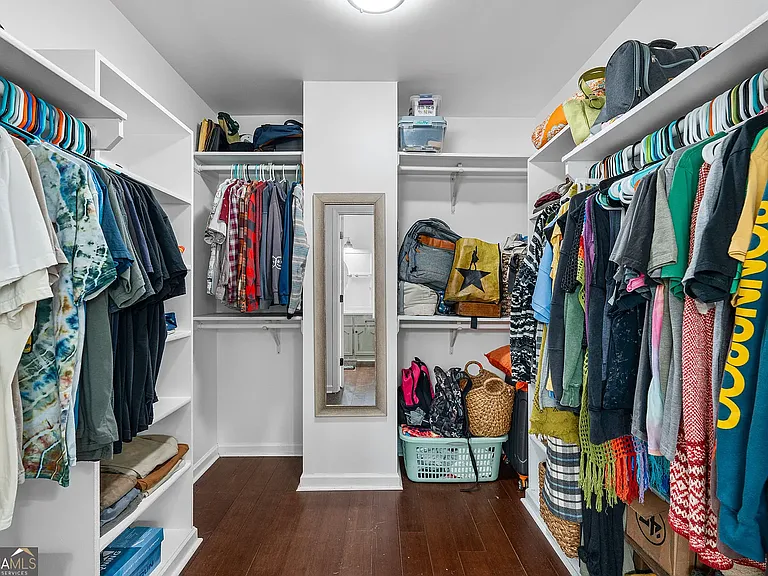 Master bedroom closet, located in bathroom