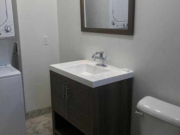 Upper level half bath with in unit washer dryer off the kitchen area