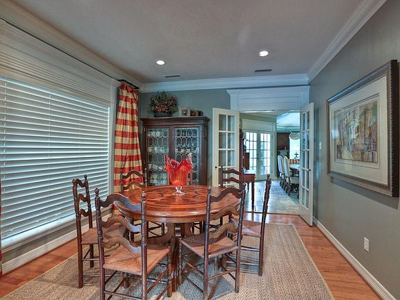 Another angle of formal dining showing access into kitchen area.