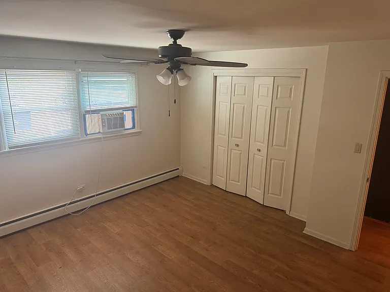 Bedroom two facing the back patio. Large closet.