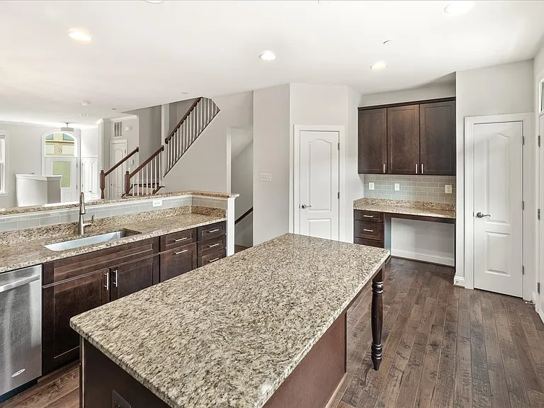 Gourmet Kitchen with Granite countertops, stainless appliances, with built in desk