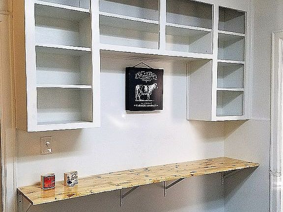 Open cabinets & wood counter