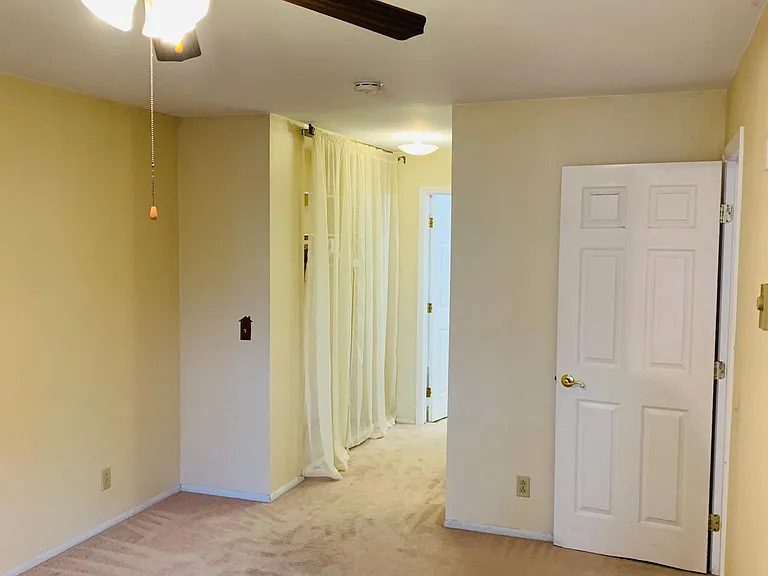 Master bedroom, hallway to the bathroom