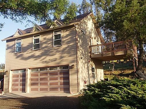 This special studio sits atop a 3-car garage that is not used for in-and-out purposes and contains laundry hook-ups for the studio tenant as well as a considerable storage area for tenant's personal property; beneath deck is tenant's totally dry and prote