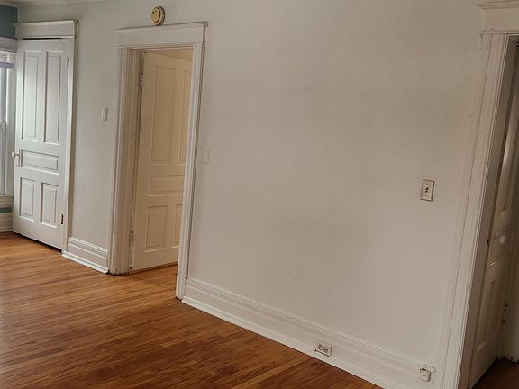 Livingroom leads into bedroom (left) and kitchen (right)