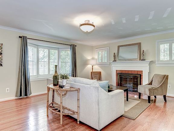 wood burning fireplace and bay window