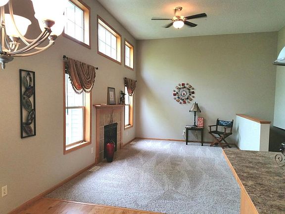 Open, spacious living room or (Great Room) with a wall of windows allowing natural lighting to flow.