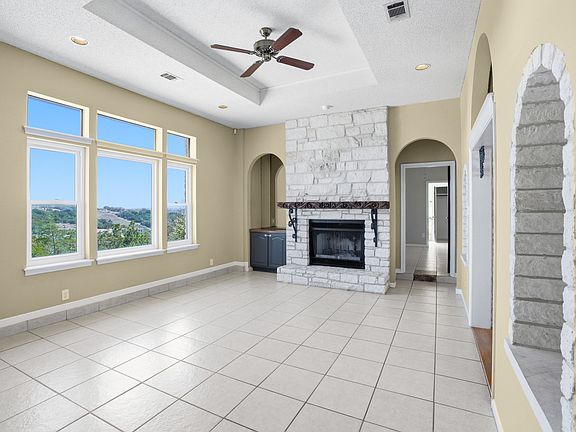 Living room #1, complete with fireplace and gorgeous hill country views!