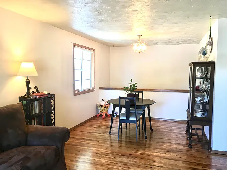 Dining room, with half-wall over the stairs to the basement.