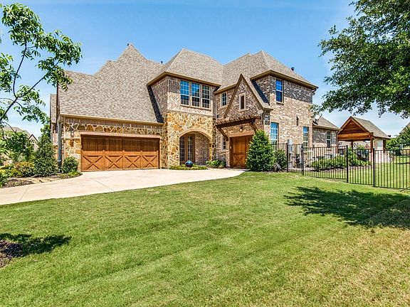 Oversize split 3 Car Garage with Cedar Garage doors.  Separate side entrance.