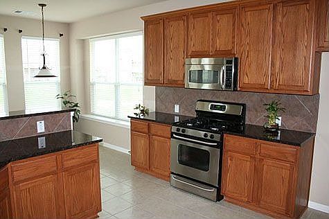 Kitchen with Granite Countertop and Stainless steel appliances